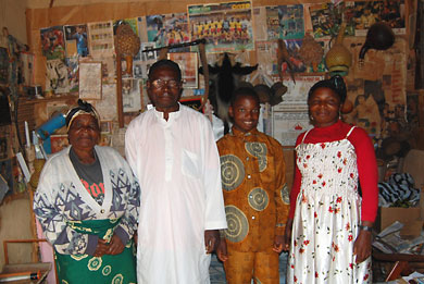 George with his mother Bongburi, wife Grace, and youngest child, Gildas in their Sar-Ntoh compound