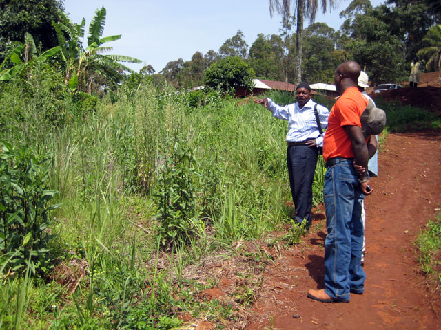 Rural water engineer Visi Edwin explains to HIC staff members how the well will be installed.
