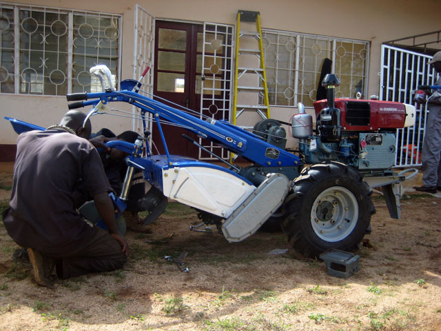 Assembling one of the tillers.