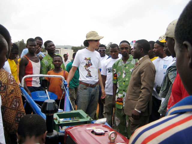 HIC volunteer John Daskovsky tells a group of onlookers about the new tractors. The tractors will be available to the community through a service rental program, which will enable farmers to cultivate more land with greater ease.